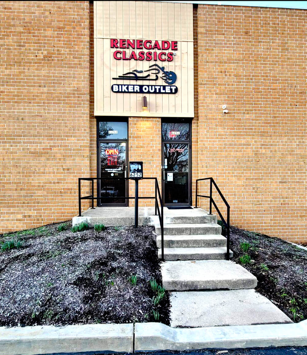 the "Renegade Classics Biker Outlet" storefront with a lit "Open" sign and stairs leading up to the entrance.